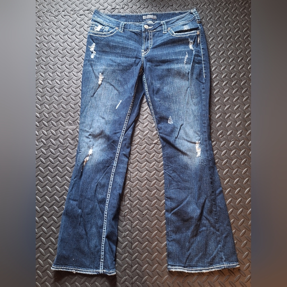 Silver Apparel Blue Flare Jeans with Distressed Accents